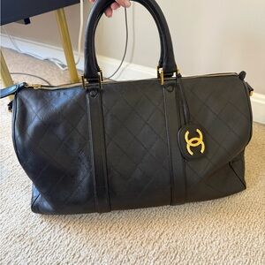 CHANEL Black Quilted Leather Travel Weekender with Gold Logo Charm